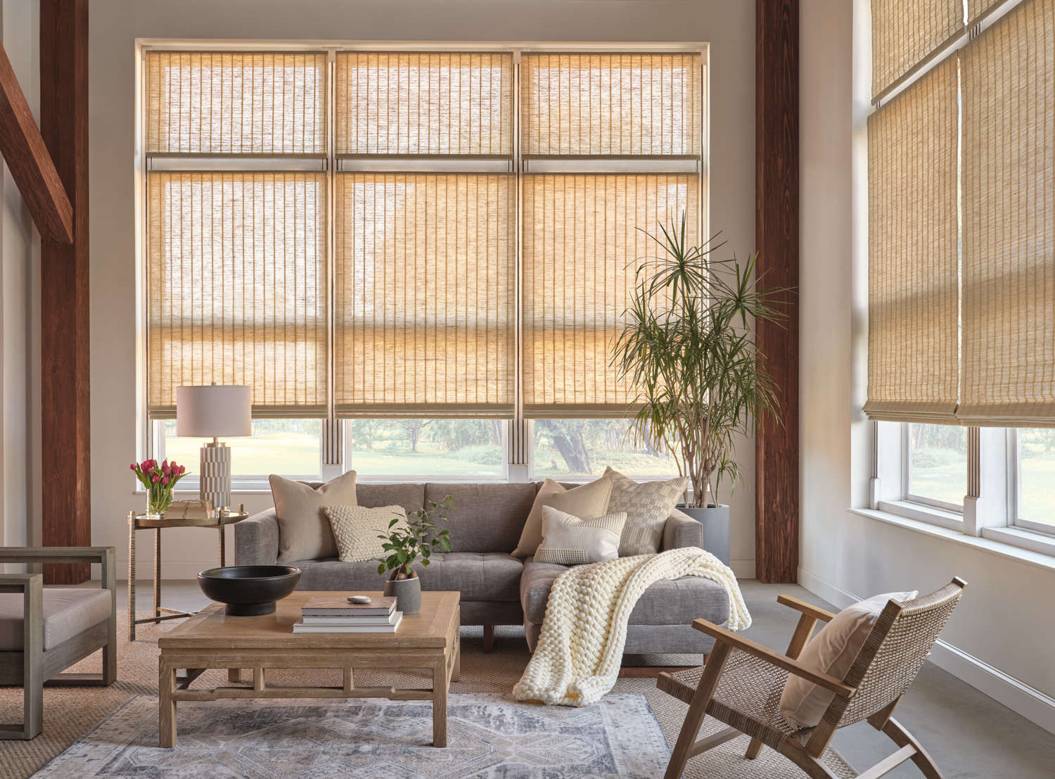 Natural woven wood Roman shades with a classic design for a touch of elegance in any room.