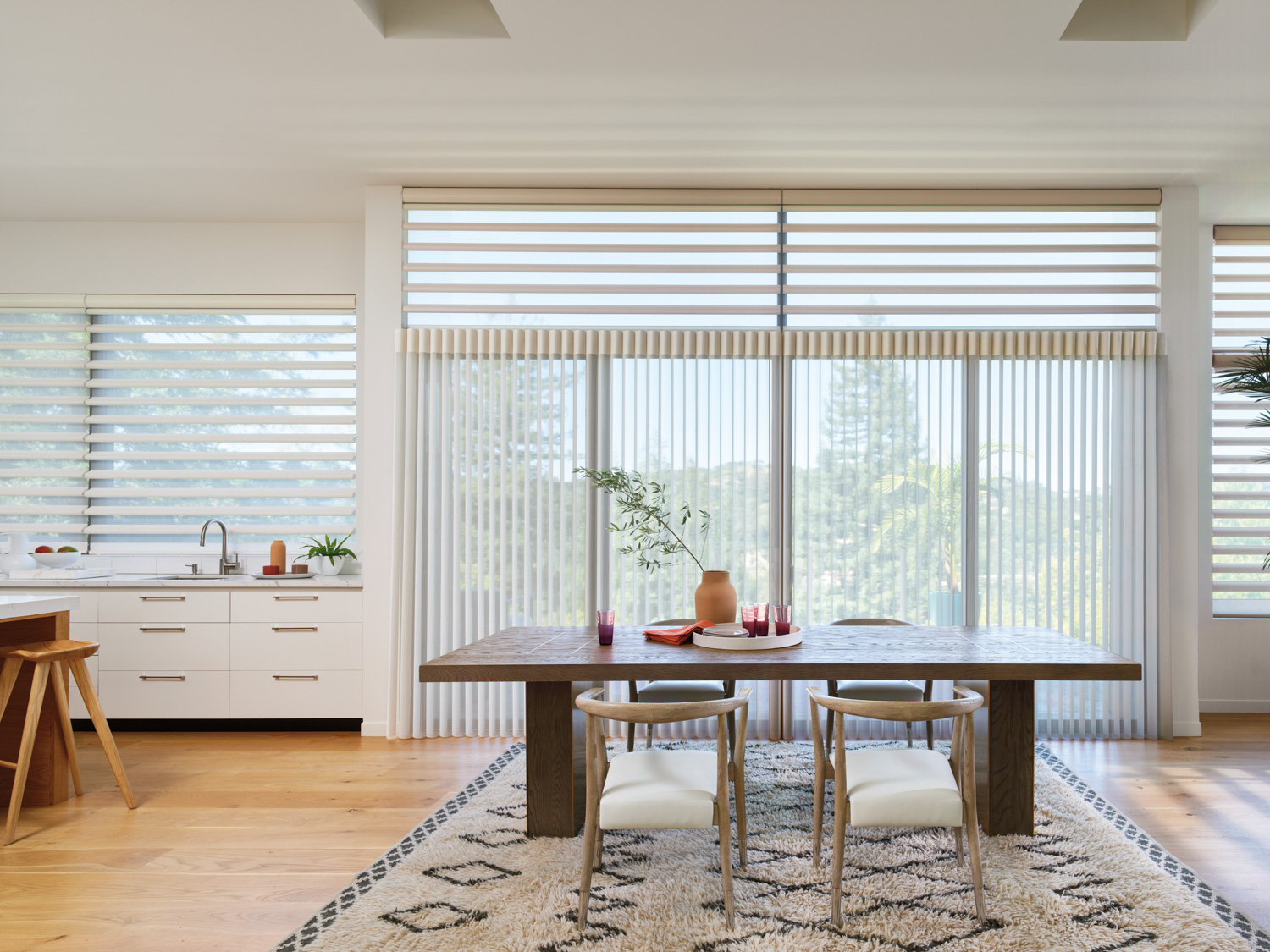 Hunter Douglas Pirouette® Sheer Shades complement the dining room's table and chairs.