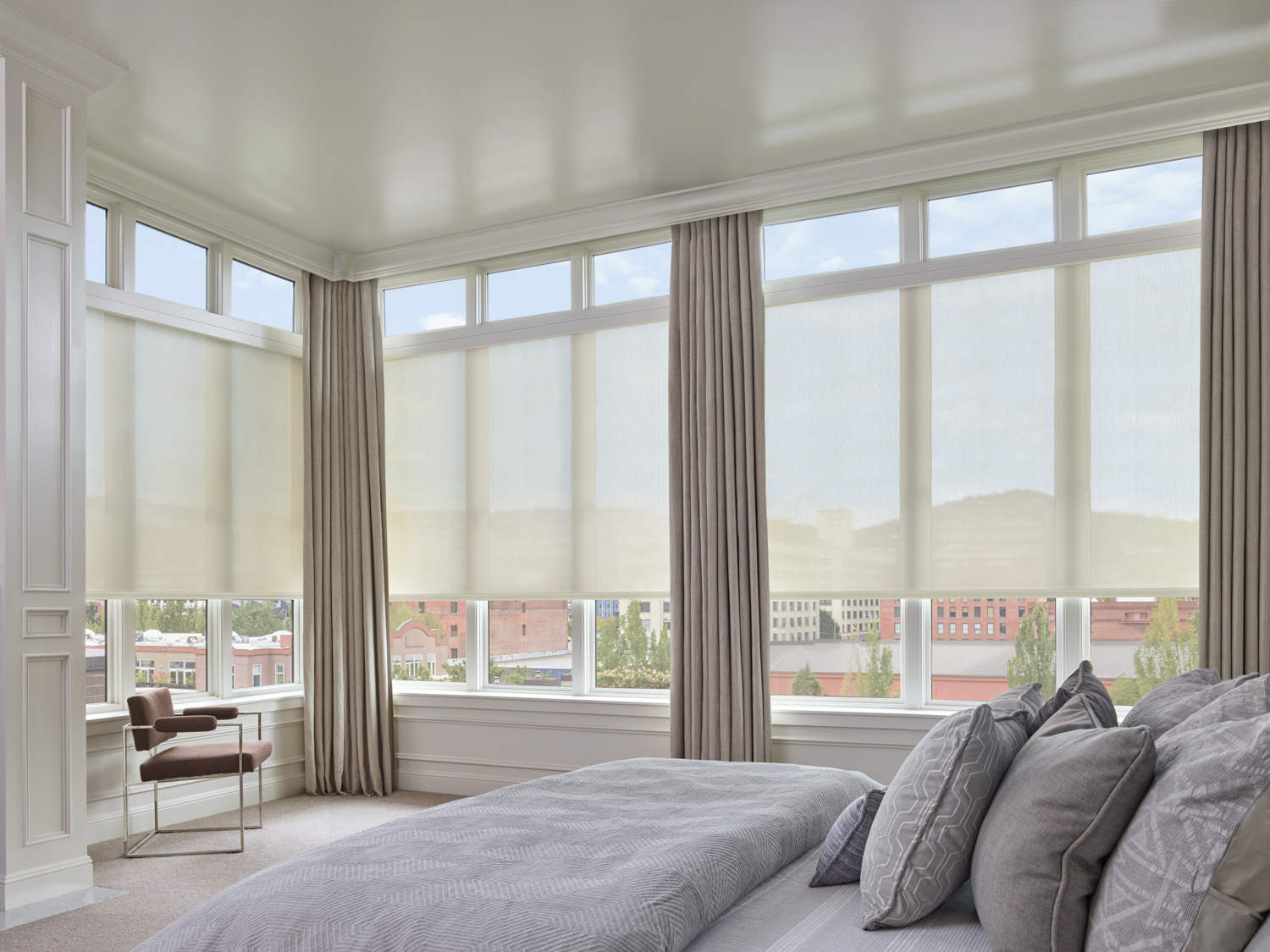 Designer Solar Shades by Hunter Douglas in a bedroom, providing stylish sun protection and privacy.