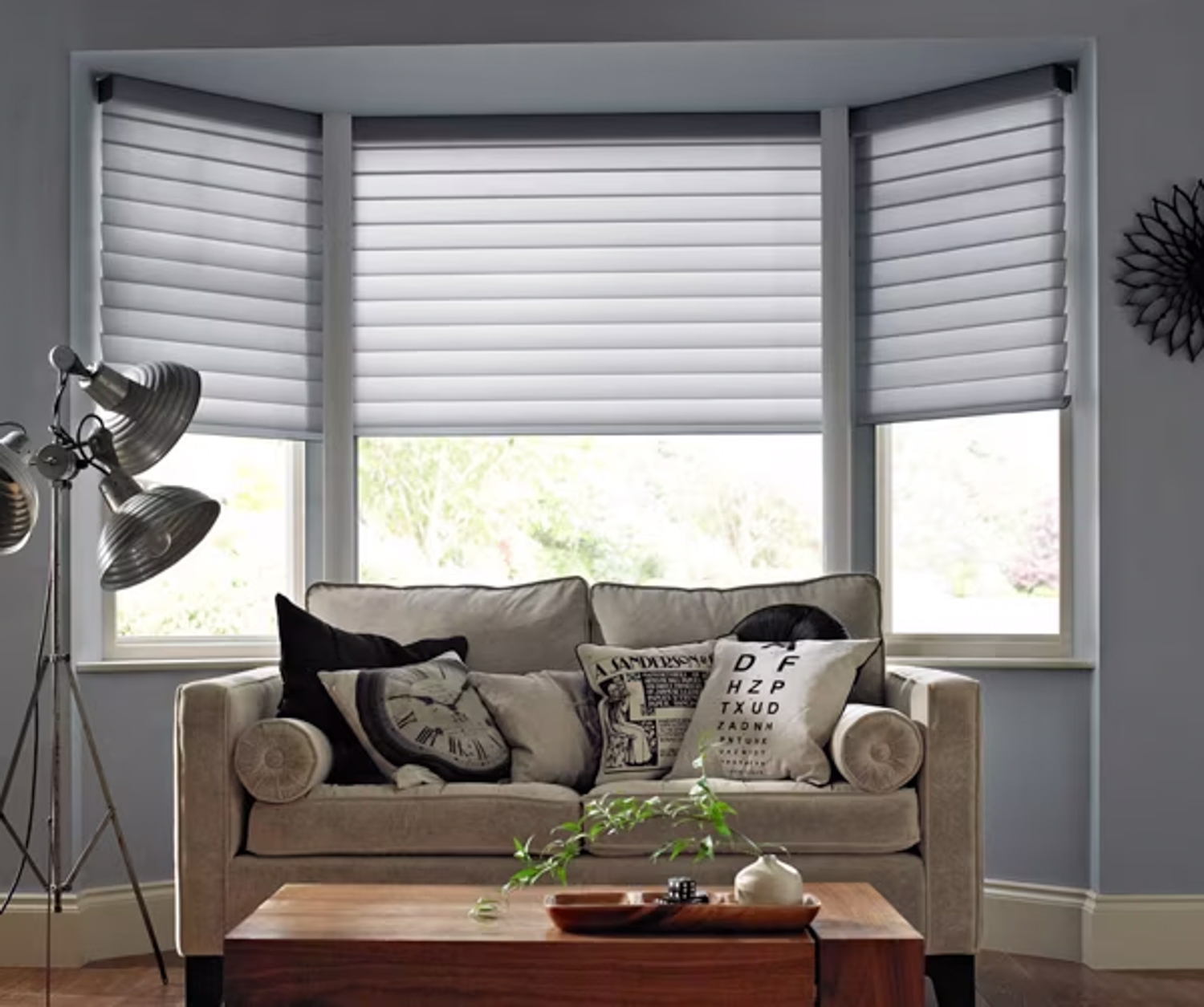 Lounge area with seating and window treatments, highlighting Hunter Douglas Silhouette® Sheer Shades.