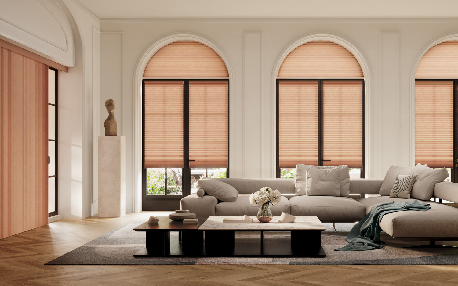 Hunter Douglas Duette® Cellular Shades in a living room with arched windows and a couch.