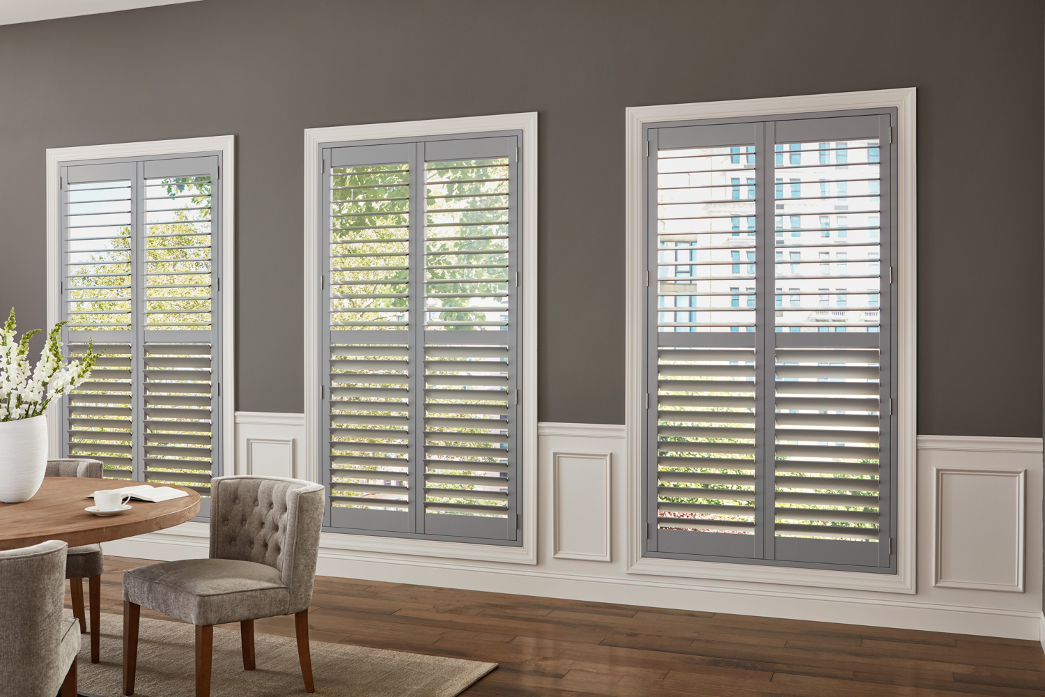 Stylish wood shutters in dining room.