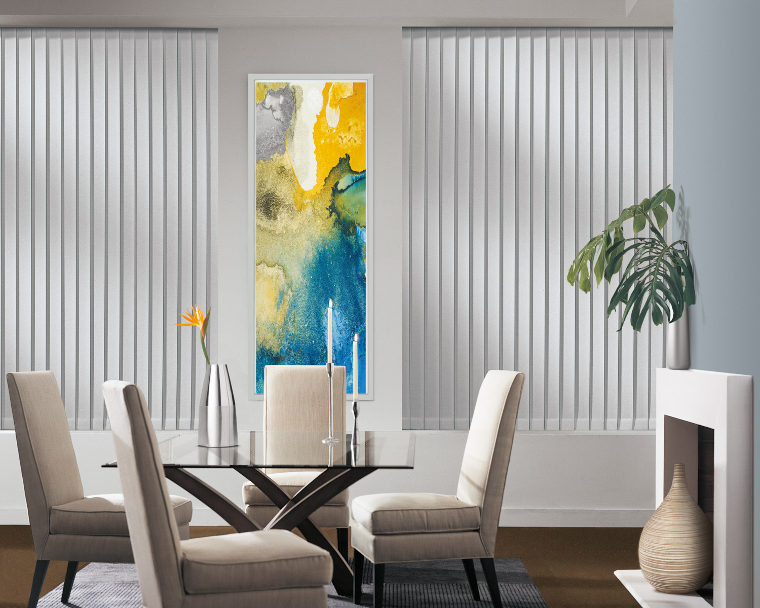 Stylish dining room decor with white walls, yellow artwork, and Hunter Douglas Somner® Vertical Blinds.